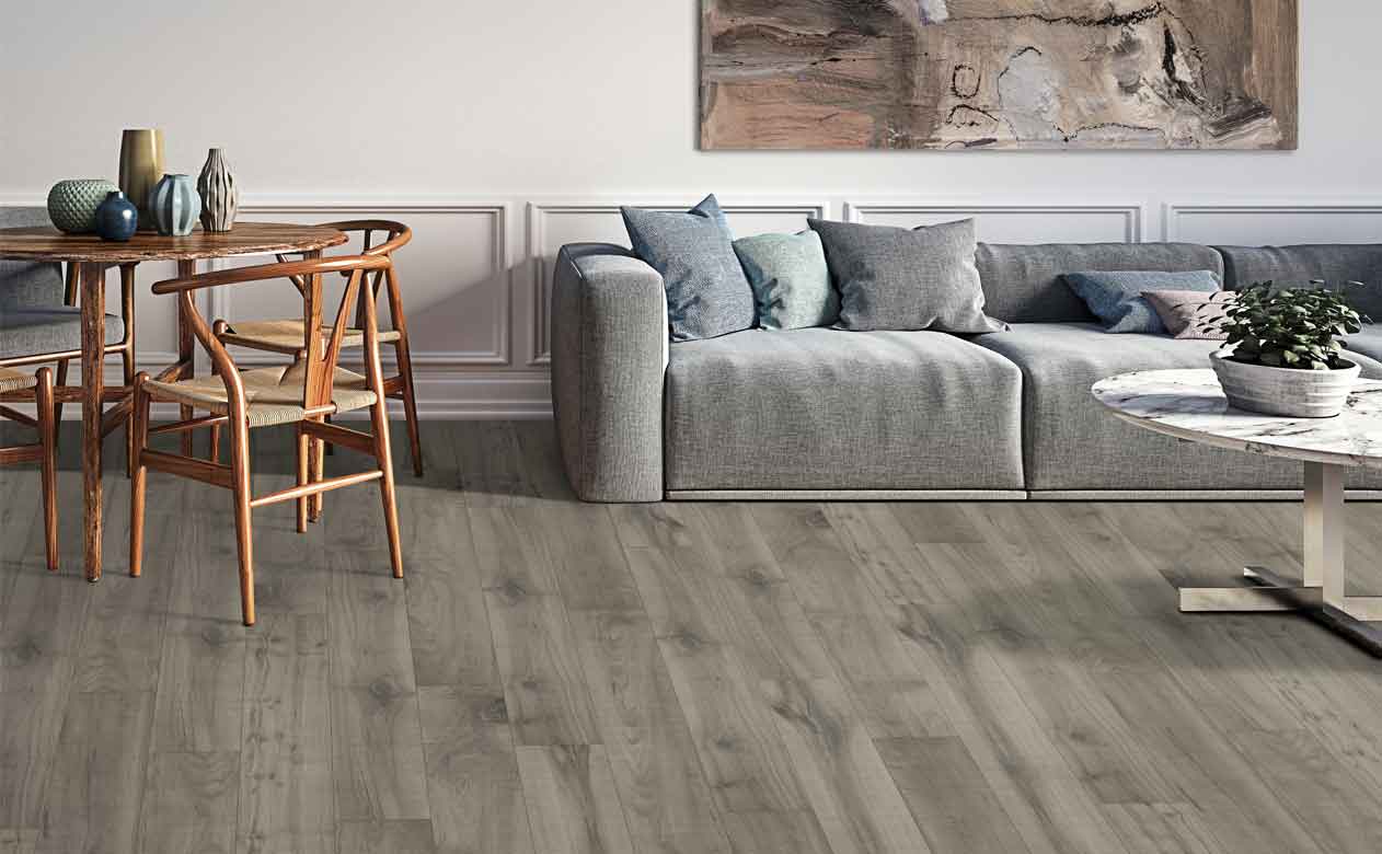 Living room with laminate flooring and brown grey couch